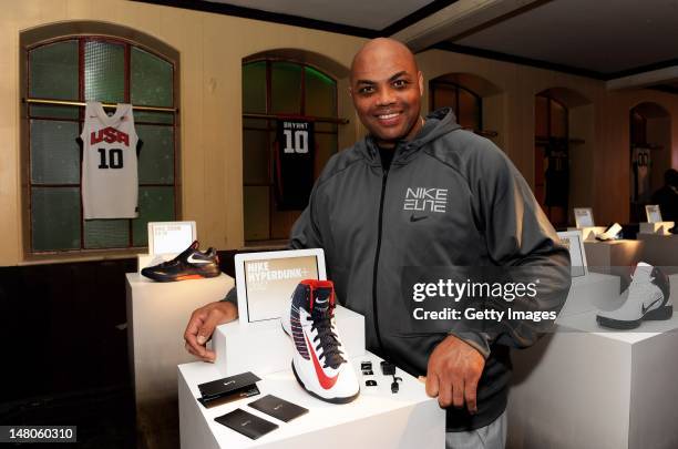 Charles Barkley poses with the latest basketball innovation, the Nike Hyperdunk+, which measures how high, how hard and how quick ballers play the...