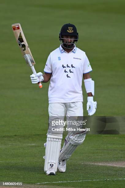 Cheteshwar Pujara of Sussex acknowledges the crowd's applause after reaching his half century during the LV= Insurance County Championship Division 2...