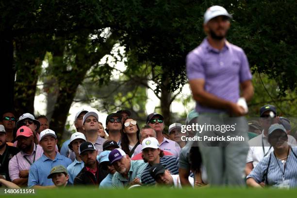 Fans look on as Max Homa of the United States plays from the fourth tee during the second round of the 2023 Masters Tournament at Augusta National...