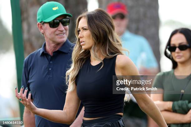 Dustin Johnson of the United States's wife Paulina Gretzky looks on with her father Wayne Gretzky during the second round of the 2023 Masters...