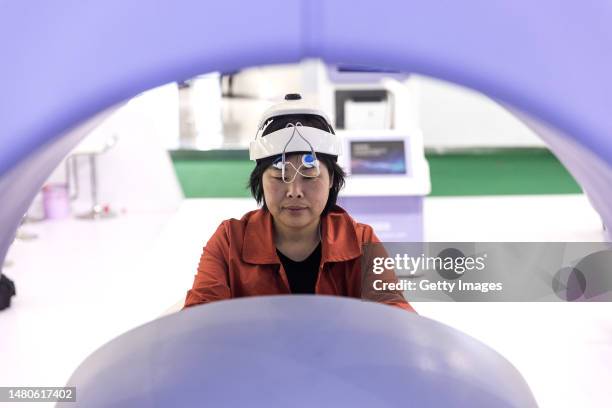 The guest experience medical equipment during the 2023 World Health Expo held in Wuhan International Expo Center on April 7,2023 in Wuhan, Hubei...