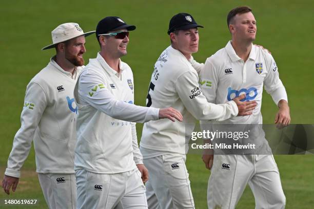 Matt Kuhnemann of Durham celebrates with Ben Raine, Alex Lees and Matthew Potts after dismissing George Garton of Sussex during the LV= Insurance...