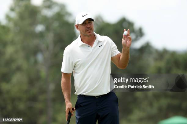 Brooks Koepka of the United States reacts on the 18th green during the second round of the 2023 Masters Tournament at Augusta National Golf Club on...