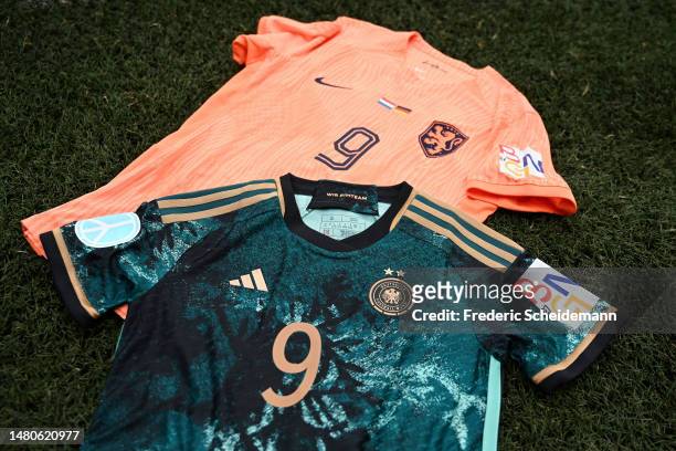 The Belgium, Germany, and Netherlands 2027 FIFA Women's World Cup bid badge is seen on a Germany and Netherlands shirt prior to the Women's...