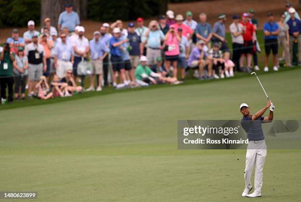 Tiger Woods of the United States plays a shot on the second hole during the second round of the 2023 Masters Tournament at Augusta National Golf Club...