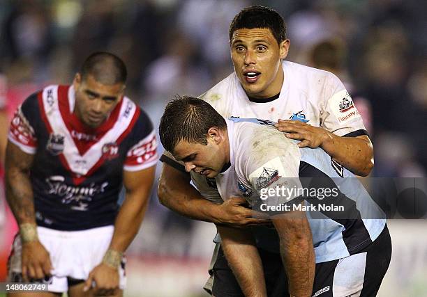 Anthony Tupou and Wade Graham of the Sharks embrace after the round 18 NRL match between the Cronulla Sharks and the Sydney Roosters at Toyota...