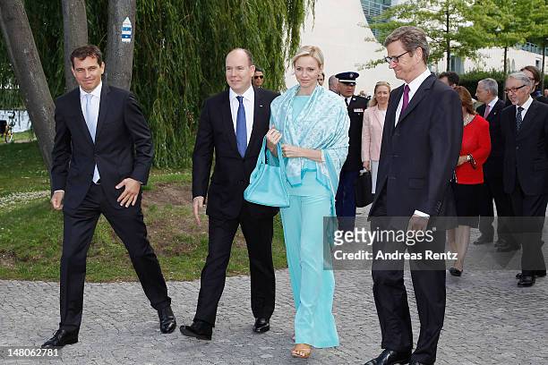German Foreign Minister Guido Westerwelle , Prince Albert II with Princess Charlene of Monaco and Michael Mronz arrive for a boat tour on the Spree...