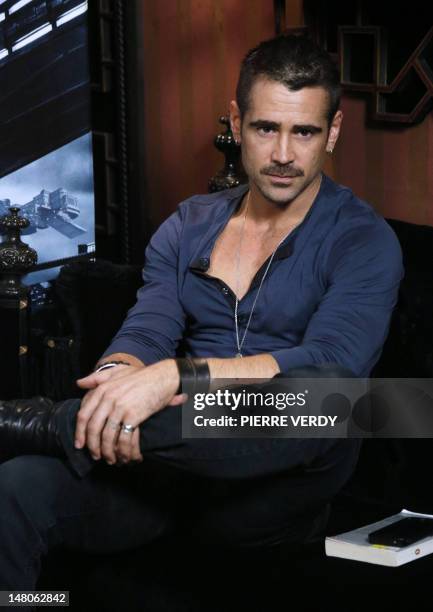 Irish actor Colin Farrell poses during a photocall as part of the presentation of his latest film "Total Recall" on July 9, 2012 at the Hotel Costes...