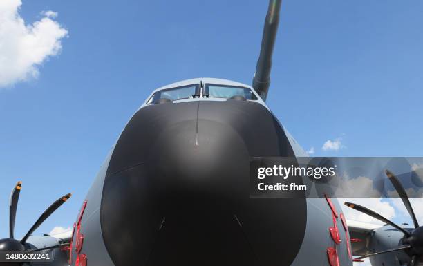 cockpit and radar nose of a military aircraft - difendere foto e immagini stock
