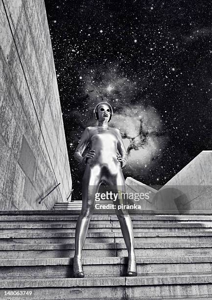 woman in silver body suit - gray alien stock pictures, royalty-free photos & images