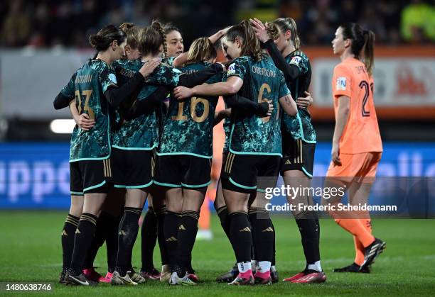 Sydney Lohmann of Germany celebrates with teammates after scoring the team's first goal during the Women's international friendly match between...