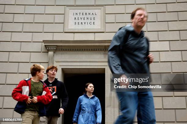 Tourists walk past the headquarters of the Internal Revenue Service near the National Mall on April 07, 2023 in Washington, DC. The Treasury...