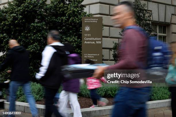 Tourists walk past the headquarters of the Internal Revenue Service near the National Mall on April 07, 2023 in Washington, DC. The Treasury...