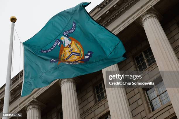 Flag with the seal of the Treasury Department flies outside the headquarters of the Internal Revenue Service on April 07, 2023 in Washington, DC. The...