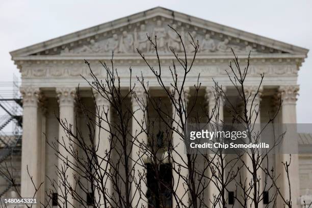Branches slightly obscure the facade of the U.S. Supreme Court building April 07, 2023 in Washington, DC. According to a ProPublica report published...