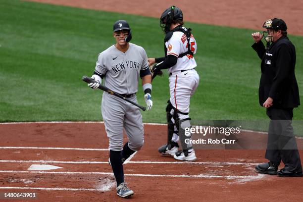 Aaron Judge of the New York Yankees reacts after striking out against the Baltimore Orioles in the first inning during the Orioles home opener at...