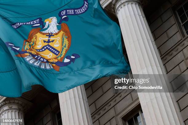 Flag with the seal of the Treasury Department flies outside the headquarters of the Internal Revenue Service on April 07, 2023 in Washington, DC. The...