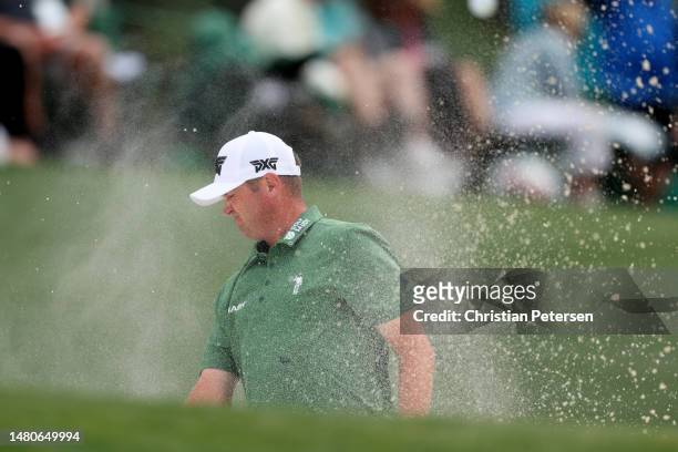 Jason Kokrak of the United States reacts to his shot from the 18th bunker during the second round of the 2023 Masters Tournament at Augusta National...