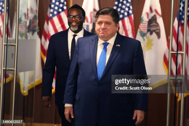 Chicago Mayor-Elect Brandon Johnson and Illinois Governor J.B. Pritzker prepare to speak to the press after a meeting in the governor's office on...