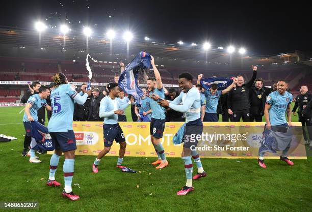 Burnley players celebrate after they had sealed promotion back to the Premier League after the Sky Bet Championship between Middlesbrough and Burnley...