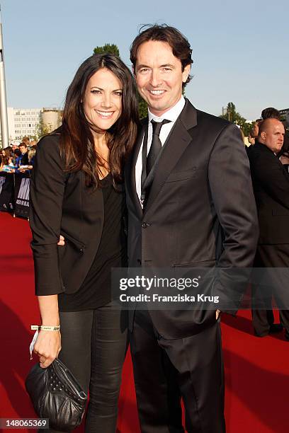 Bettina Zimmermann and Martin Bachmann attend the Men In Black 3 Germany Premiere at O2 World on May 14, 2012 in Berlin, Germany.