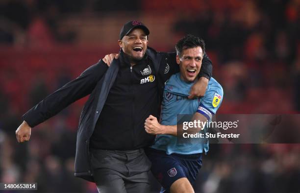 Burnley Manager Vincent Kompany celebrates with Jack Cork after Burnley had sealed promotion after the Sky Bet Championship between Middlesbrough and...