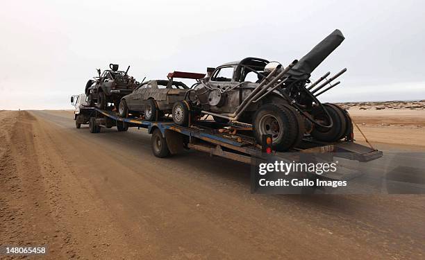 Three cars used in the film "Mad Max 4: Fury Road", are transported to the dunes outside Swakopmund where the film is currently being filmed on July...