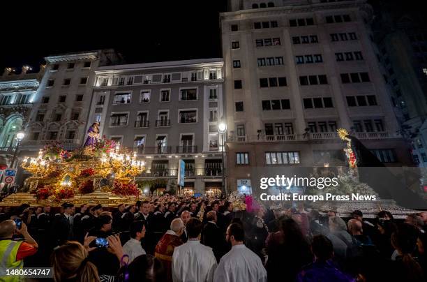 The paso of Our Father Jesus the Nazarene meets the paso of the Virgin of the Convent of Calatrava during the procession of the Christ of Medinaceli,...