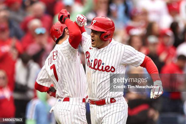 Trea Turner of the Philadelphia Phillies and J.T. Realmuto of the Philadelphia Phillies react following a two run home run by Realmuto during the...