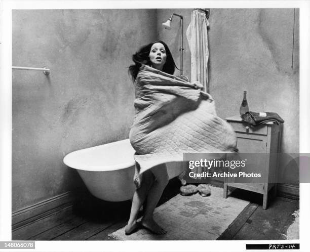 Ayn Rumen Ayn Ruymen wearing only a towel before bath in a scene from the film ...