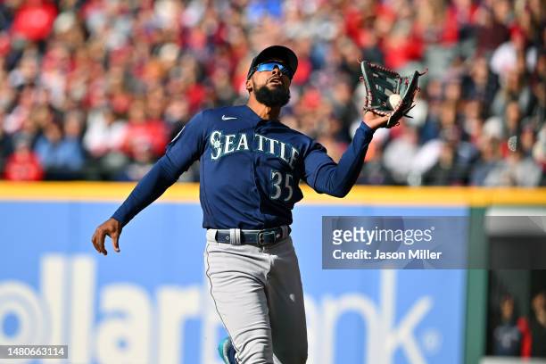 Right fielder Teoscar Hernandez of the Seattle Mariners catches a fly ball hit by Amed Rosario of the Cleveland Guardians during the fifth inning of...