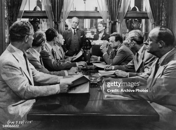 Ed Begley, Everett Sloane , Van Heflin, and board members gather in meeting in a scene from the film 'Patterns', 1956.