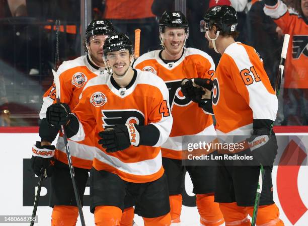 Morgan Frost of the Philadelphia Flyers celebrates his first period goal against the Buffalo Sabres with Brendan Lemieux, Nick Seeler, and Justin...