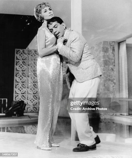 Janet Leigh dancing with Cantinflas in a scene from the film 'Pepe', 1960.