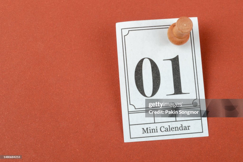 Mini calendar with the date 1st pinned to a red background.