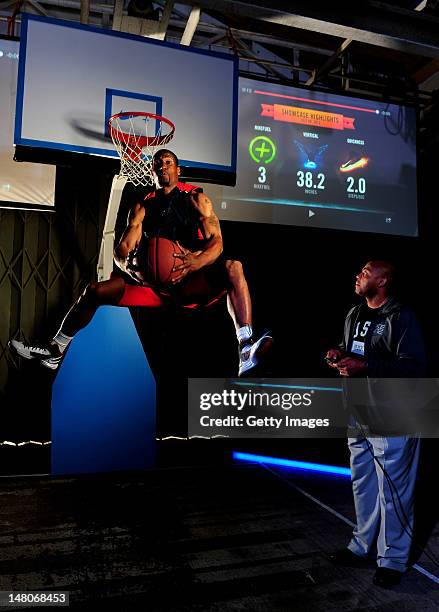 Player Leon Bernard is pictured dunking in Nike's latest basketball innovation, the Nike Hyperdunk+, which measures how high, how hard and how quick...