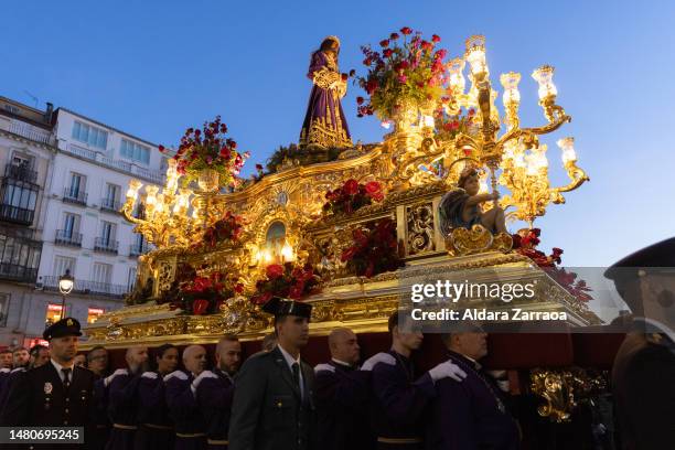 People carry The Jesus de Medinaceli figure during The Jesus de Medinaceli Easter Procession on April 07, 2023 in Madrid, Spain.