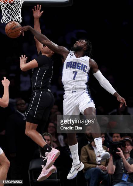 Kevon Harris of the Orlando Magic blocks a shot by Dru Smith of the Brooklyn Nets in the second half at Barclays Center on April 07, 2023 in the...
