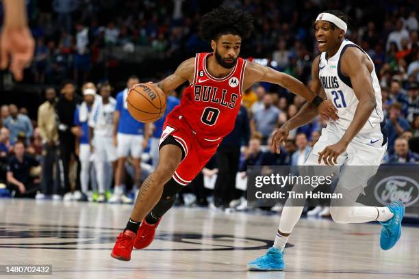 Coby White of the Chicago Bulls drives against Frank Ntilikina of the Dallas Mavericks in the second half at American Airlines Center on April 07,...