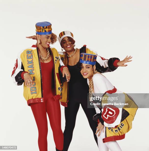 Portrait of American rap trio Salt 'n' Pepa as they pose against a white background, New York, New York, 1988. From left, Sandra Denton , Deidra...