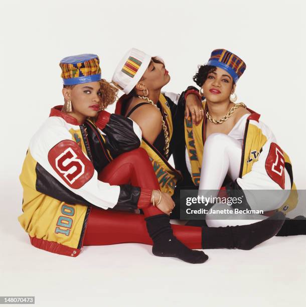 Portrait of American rap trio Salt 'n' Pepa as they pose against a white background, New York, New York, 1988. From left, Sandra Denton , Deidra...