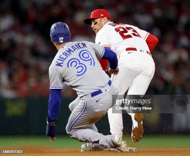 Brandon Drury of the Los Angeles Angels reacts to a force out of Kevin Kiermaier of the Toronto Blue Jays during the fifth inning of the 2023 home...