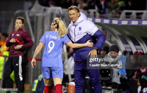 Coach of France Herve Renard congratulates Eugenie Le Sommer of France after scoring a goal during the international women's friendly match between...