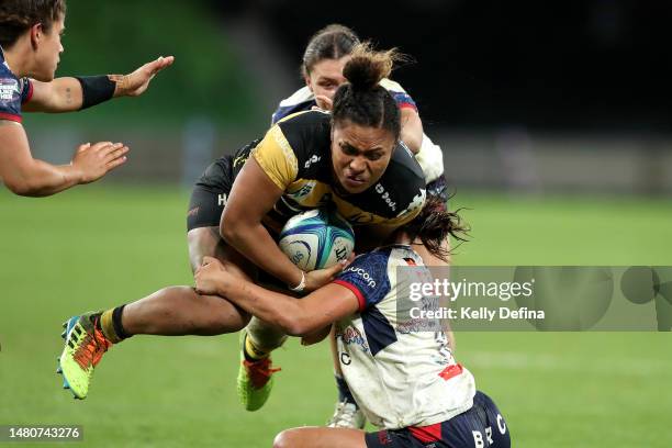 Martha Mataele of the Force is tackled by Chanelle Kohika-Skipper of the Rebels during the Super W match between Melbourne Rebels Women and Western...