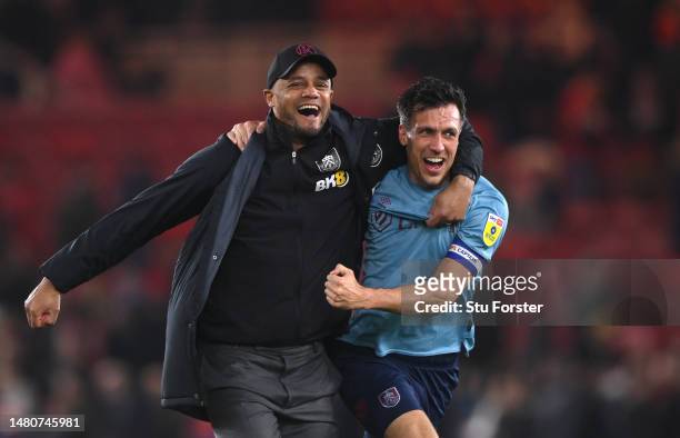 Burnley Manager Vincent Kompany celebrates with Jack Cork after Burnley had sealed promotion after the Sky Bet Championship between Middlesbrough and...