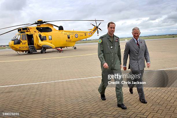 Prince Charles, Prince of Wales and Prince William, Duke of Cambridge head back to the RAF Rescue base after Prince William showed his father round...