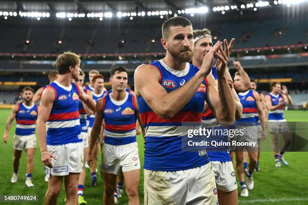 Marcus Bontempelli of the Bulldogs high fives fans after winning the round four AFL match between Richmond Tigers and Western Bulldogs at Melbourne...