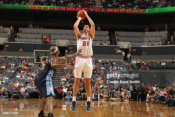 Byron Mullens of the Charlotte Bobcats shoots the ball against the Denver Nuggets during the game at the Time Warner Cable Arena on March 30, 2012 in...