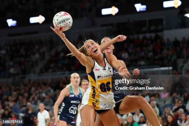 Cara Koenen of the Lightning reaches for the ball during the round four Super Netball match between Melbourne Vixens and Sunshine Coast Lightning at...