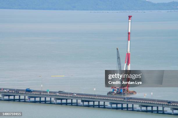 a crane vessel, crane ship or floating crane barge in the sea - mobiler kran stock-fotos und bilder